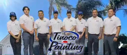 The Tinoco Painting crew in branded shirts